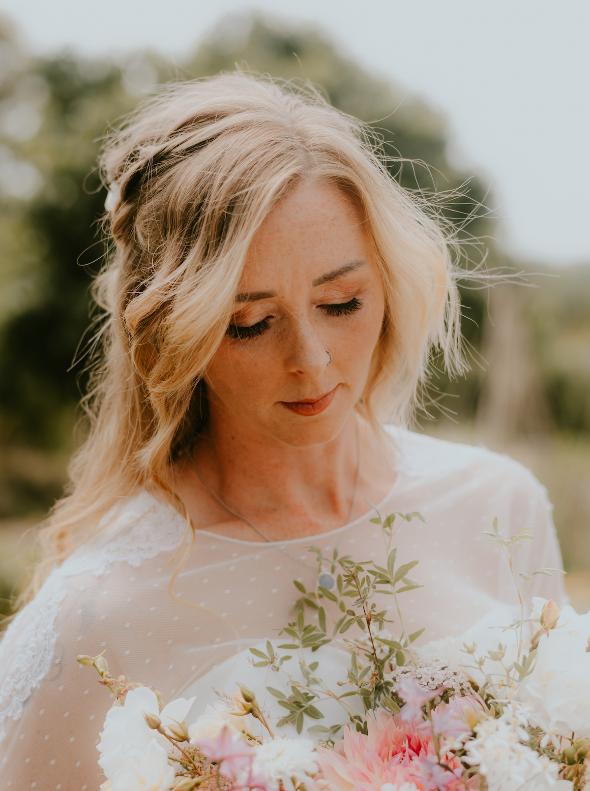 Close-up of soft glam bridal makeup with pink and gold tones by Makeup by Lisa Hannah